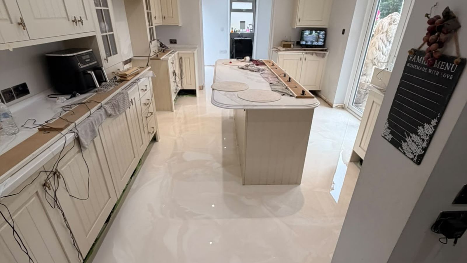 Pearl metallic poured resin kitchen floor with island