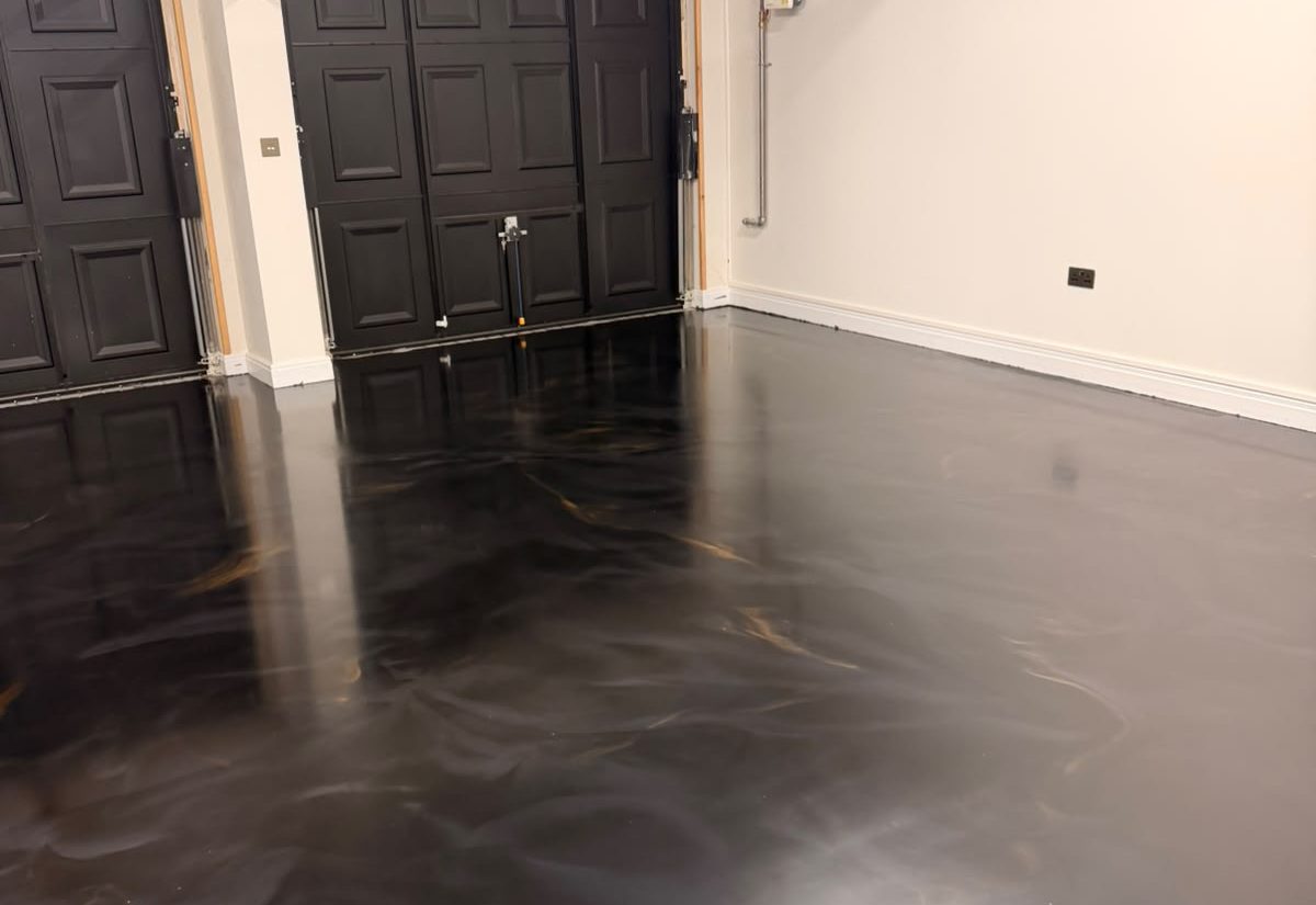 Black and bronze metallic epoxy garage floor after installation