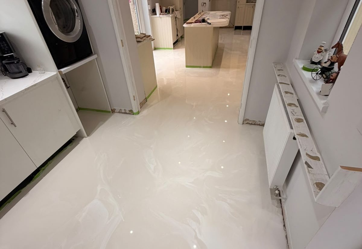 Pearl-white metallic resin kitchen floor after installation
