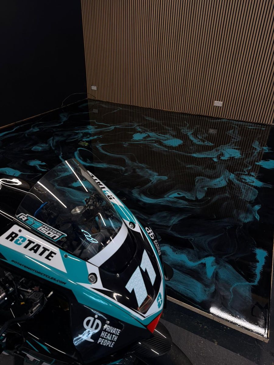 Motorcycle Showroom, commercial · metallic resin floor by Atelier Resin